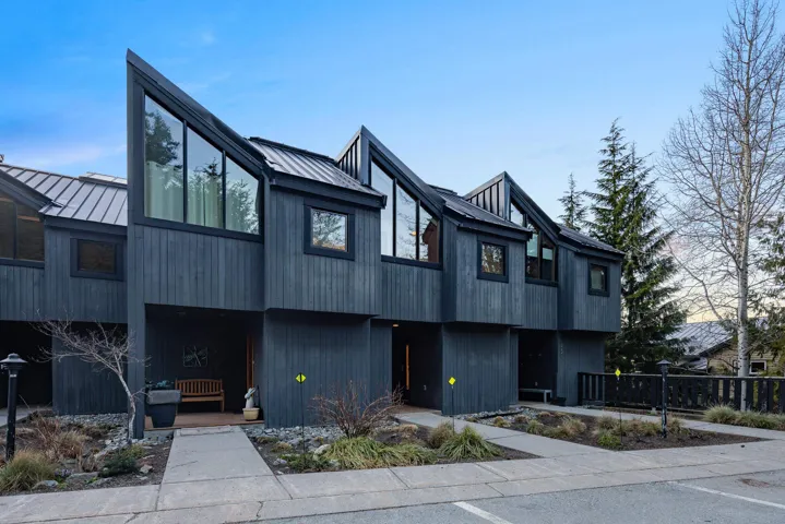 View of front facade with metal roof and a standing seam roof