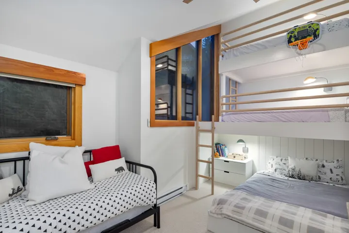 Bedroom featuring baseboard heating and carpet flooring