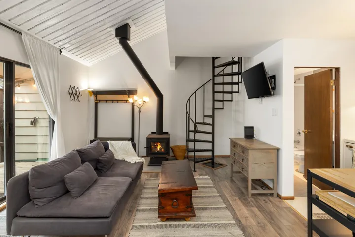 Dining space featuring wood finished floors and baseboard heating