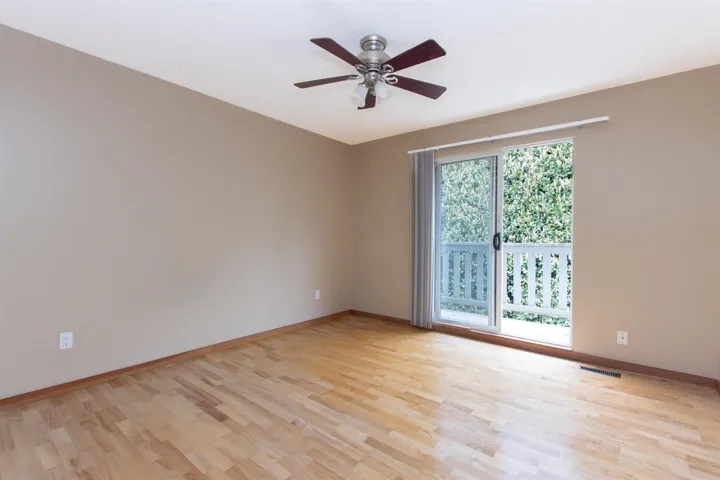Spare room featuring light wood-style flooring and a ceiling fan