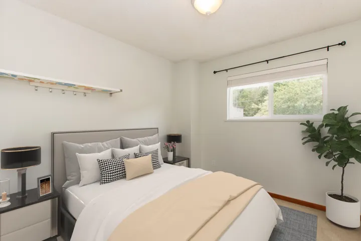 Bedroom featuring baseboards and carpet flooring