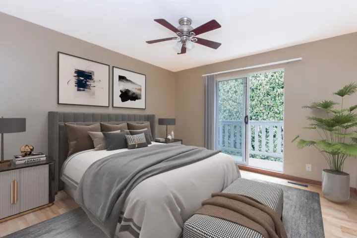 Bedroom with light wood finished floors, access to outside, and a ceiling fan