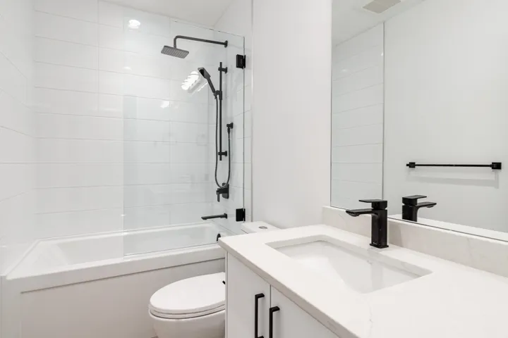 Bathroom with vanity and  shower combination