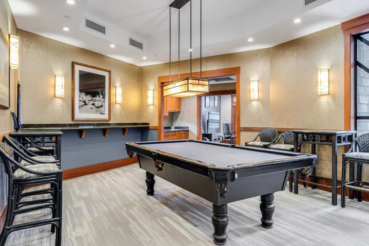 Game room with pool table, wallpapered walls, light colored carpet, and recessed lighting