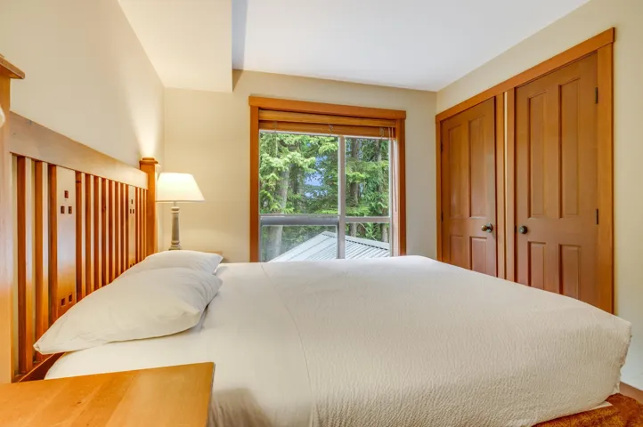 Bedroom with a closet and access to exterior