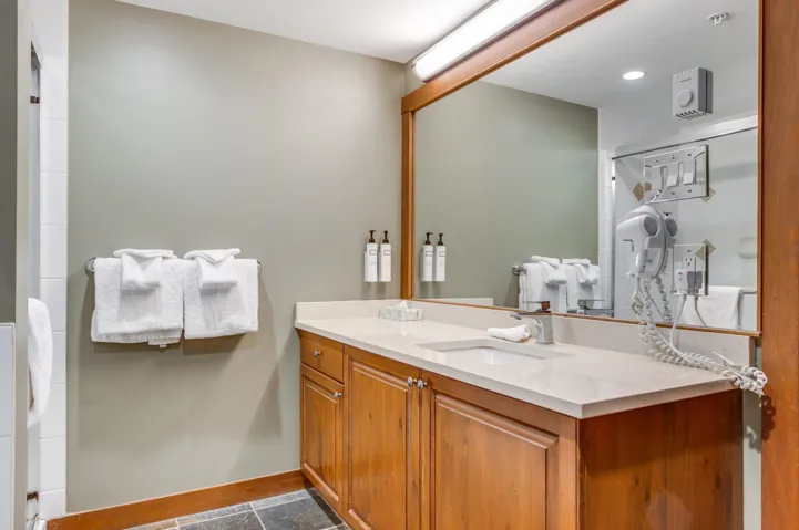 Full bathroom featuring vanity and an enclosed shower