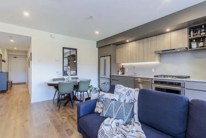 Open-concept living space featuring wood-finish flooring
