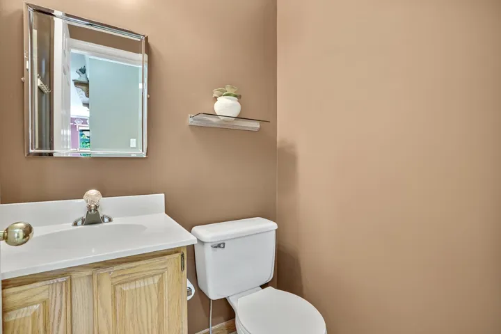 Half bath with vanity and toilet