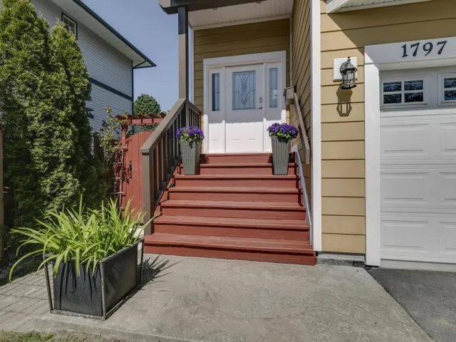 Entrance to property featuring a garage