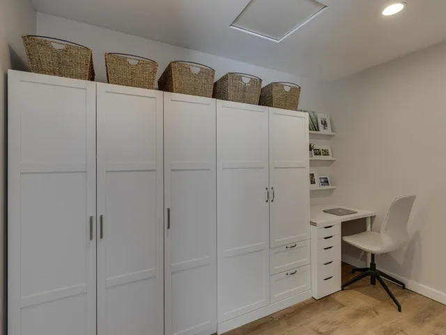 Interior space featuring recessed lighting, baseboards, attic access, and light wood-type flooring