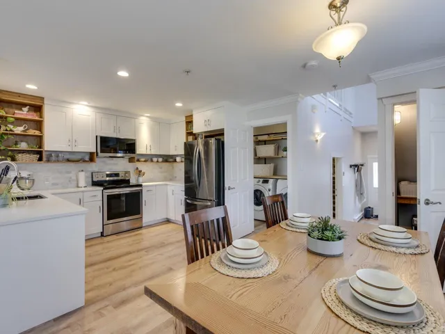 Dining area featuring recessed lighting, light wood-style floors, crown molding, and washer / clothes dryer