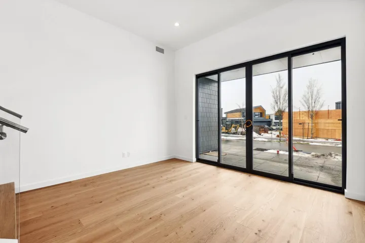 Spare room with light wood-style floors, recessed lighting, visible vents, and baseboards