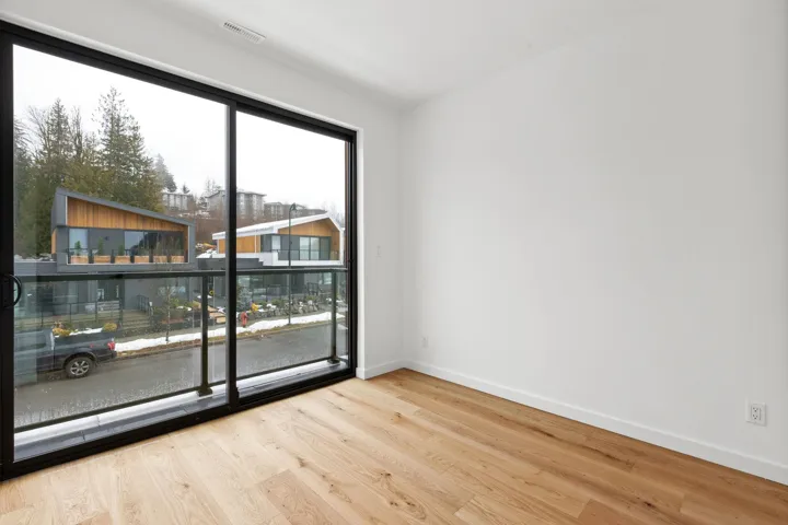 Unfurnished room featuring baseboards, visible vents, and wood finished floors