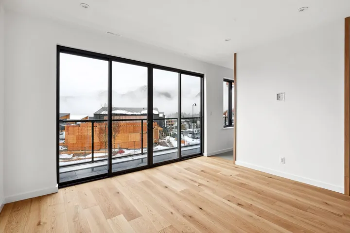 Spare room with visible vents, baseboards, and wood finished floors