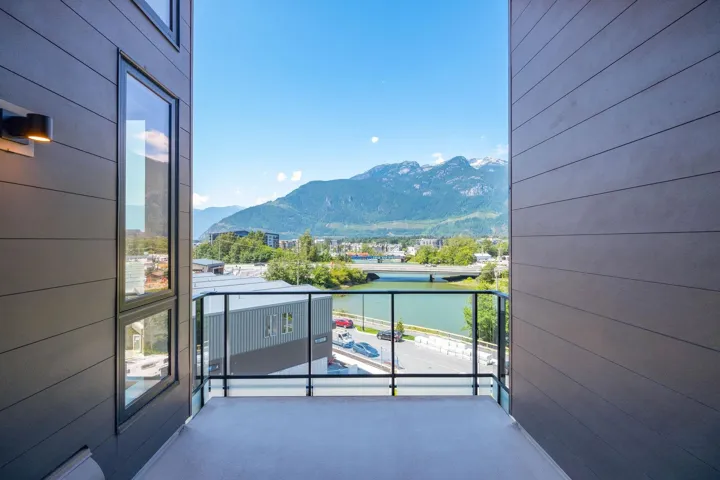 Balcony with a water and mountain view