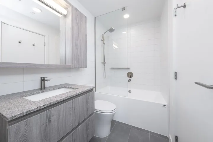 Full bath featuring vanity, shower / bathtub combination, tile patterned flooring, and recessed lighting