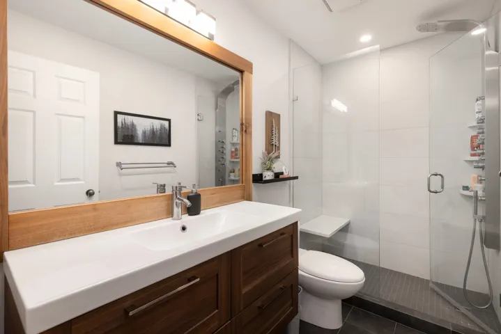Full bath featuring a shower stall, vanity, tile patterned flooring, and recessed lighting