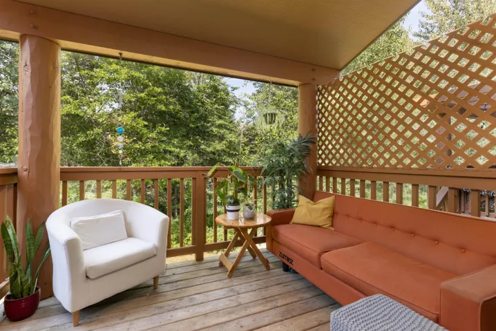 Wooden deck with an outdoor hangout area