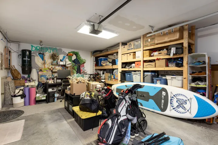 Garage featuring a garage door opener