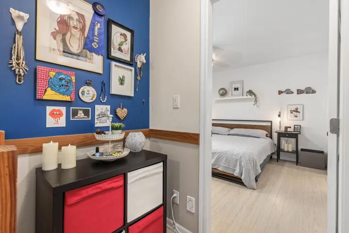 Bedroom with wood finished floors and baseboards