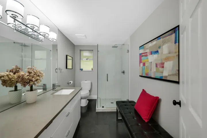 Full bath with vanity and a stall shower