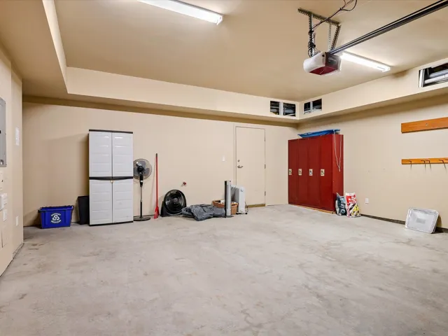 Bedroom featuring light carpet, baseboards, and a closet