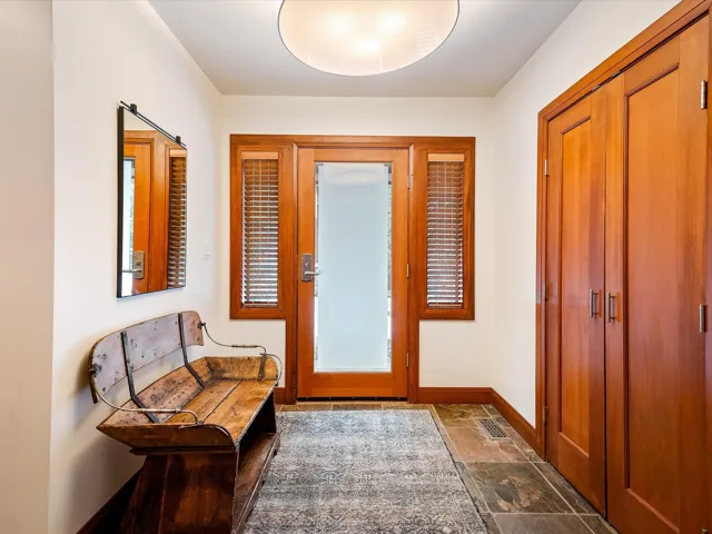 Bathroom featuring visible vents, tiled shower, vanity, and toilet