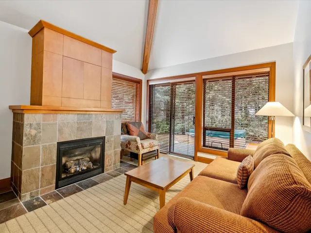 Doorway to outside with baseboards, visible vents, and stone finish floor