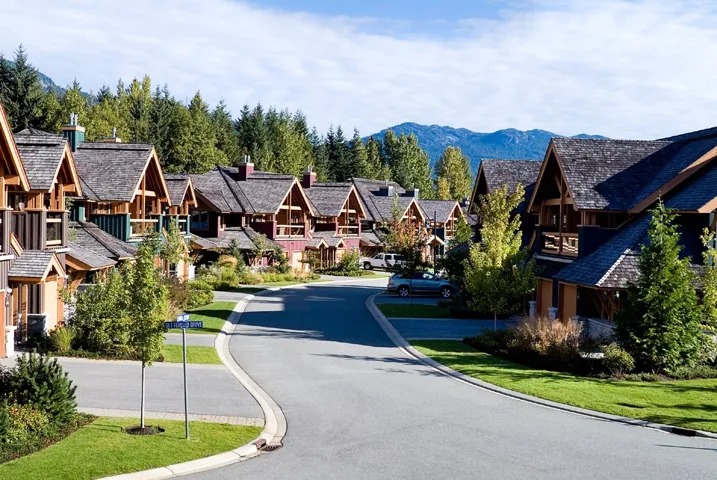 View of street featuring a mountain view, curbs, and a residential view