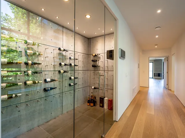 Wine area with recessed lighting and wood finished floors