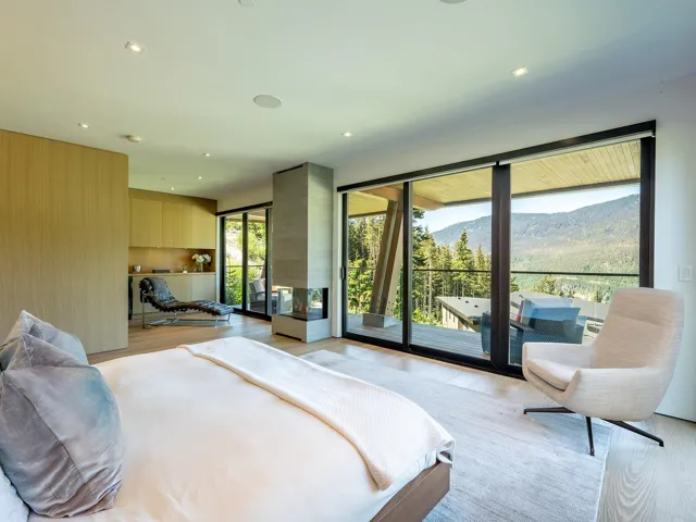 Bedroom featuring light wood finished floors, a mountain view, access to exterior, and recessed lighting