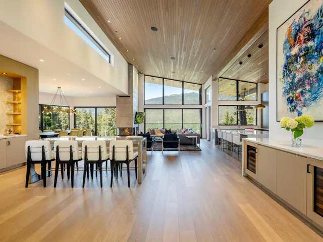 Dining area featuring recessed lighting, a towering ceiling, wooden ceiling, light wood finished floors, and expansive windows