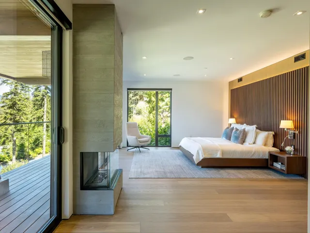 Bedroom featuring access to exterior, light wood-style floors, and recessed lighting