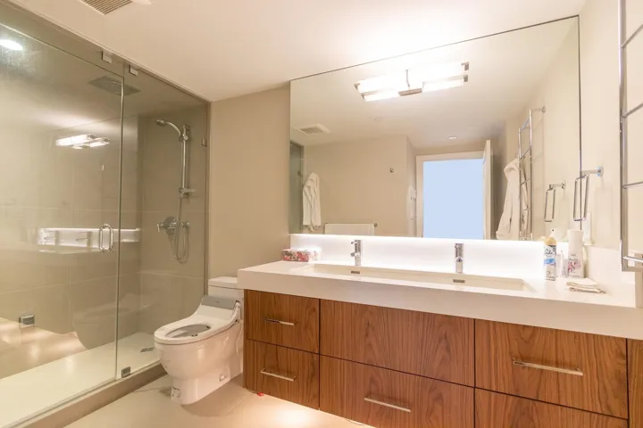 Full bathroom featuring vanity, a shower stall, and tile patterned flooring