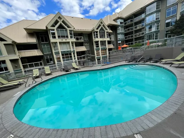 Community pool featuring a patio