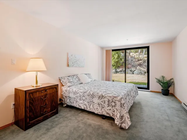 Carpeted bedroom with baseboards