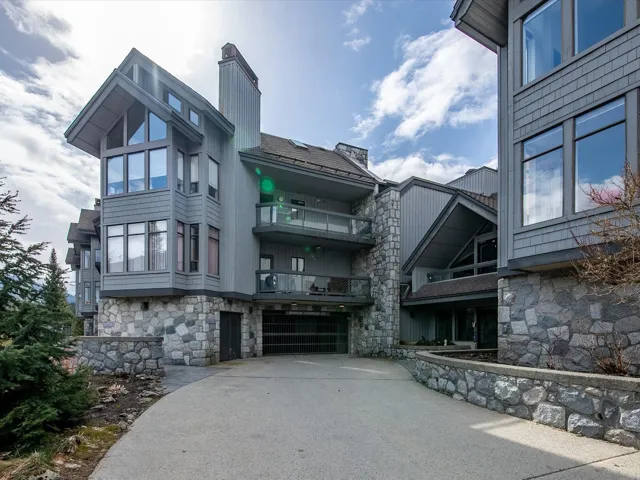 View of property with concrete driveway and an attached garage