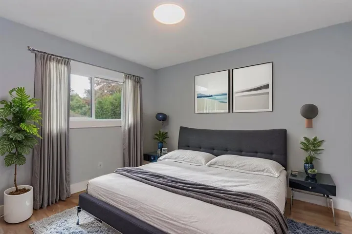 Bedroom featuring light wood-style flooring and baseboards
