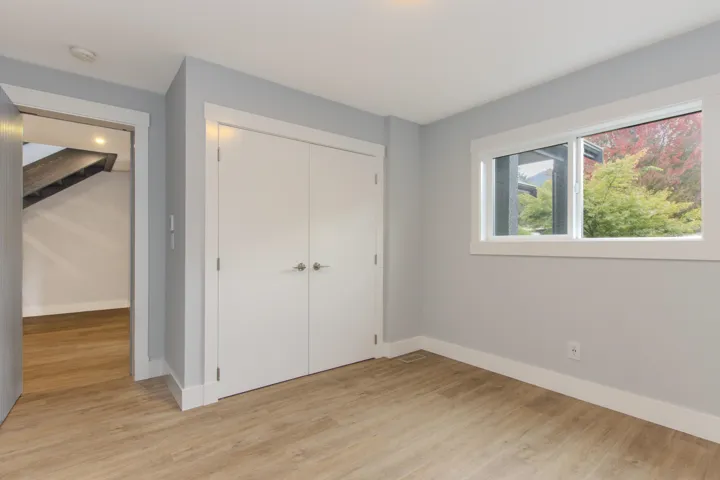Unfurnished bedroom with light wood-type flooring and a closet