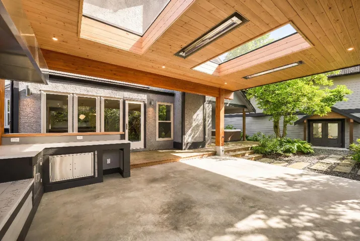 View of patio / terrace featuring french doors and an outdoor kitchen