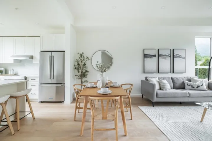 Dining space featuring light wood-style flooring and baseboards