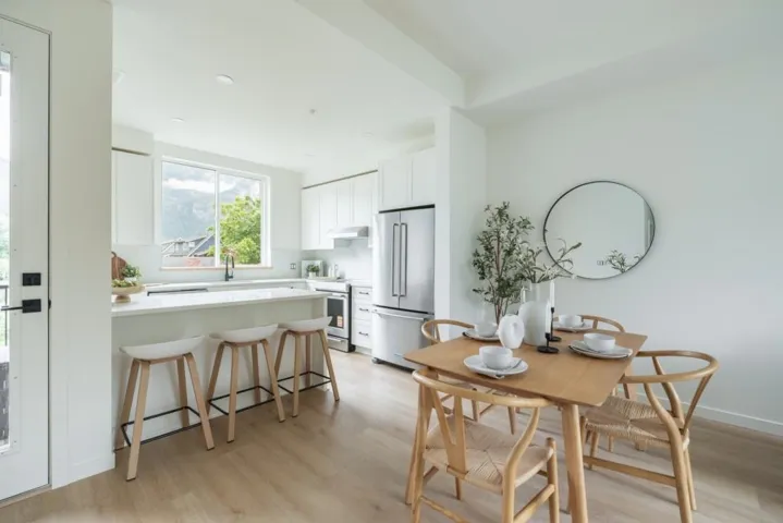 Dining space featuring light wood finished floors and recessed lighting