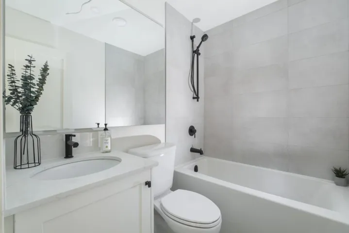 Bathroom featuring bathtub / shower combination and vanity
