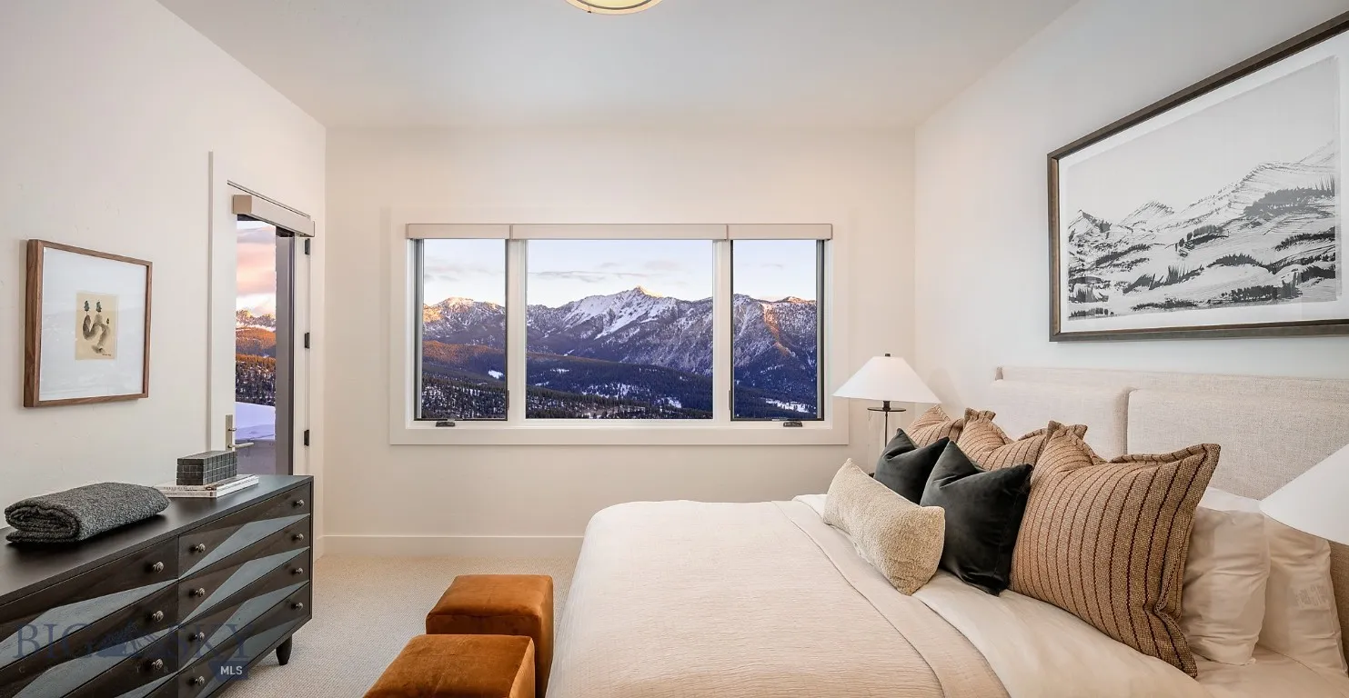 Lower level bedroom. Furnishings by Gallatin Valley Design Group.