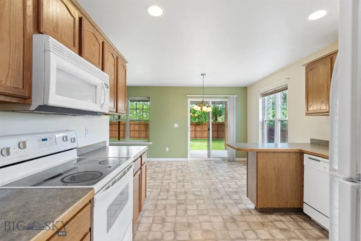Kitchen all the way to backyard.  New fence in the background