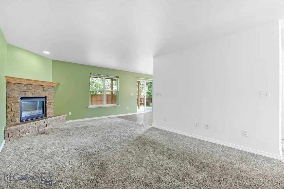 Living Room with glimpse of the backyard and dining area
