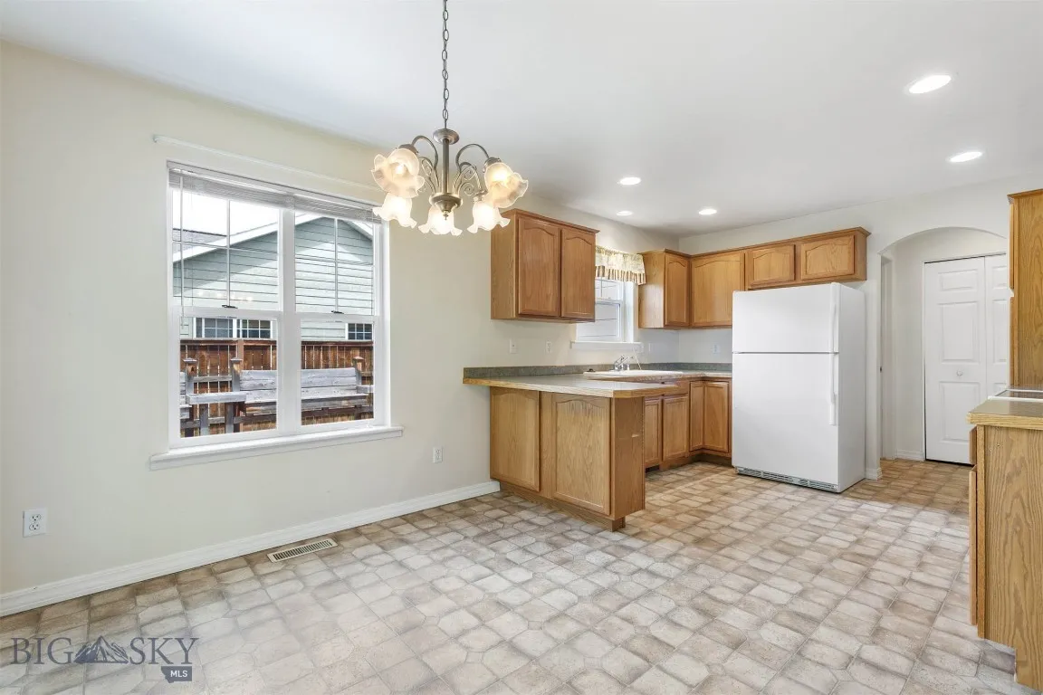 Kitchen also leads to Laundry and extra storage/pantry