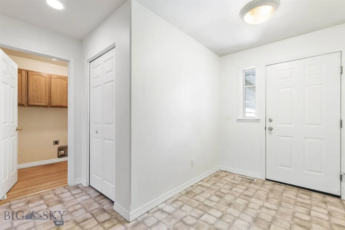 Front entry and laundry room leading to garage