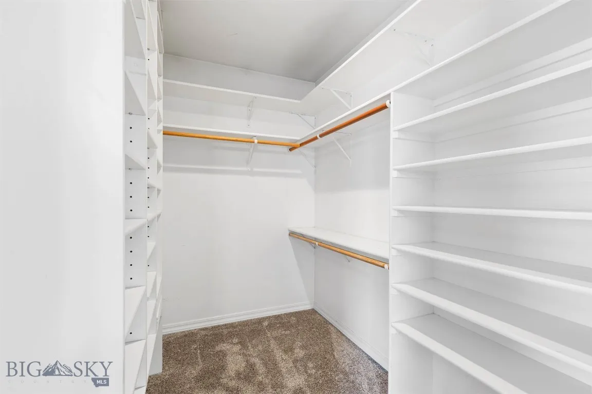 Primary walk-in closet with built-ins
