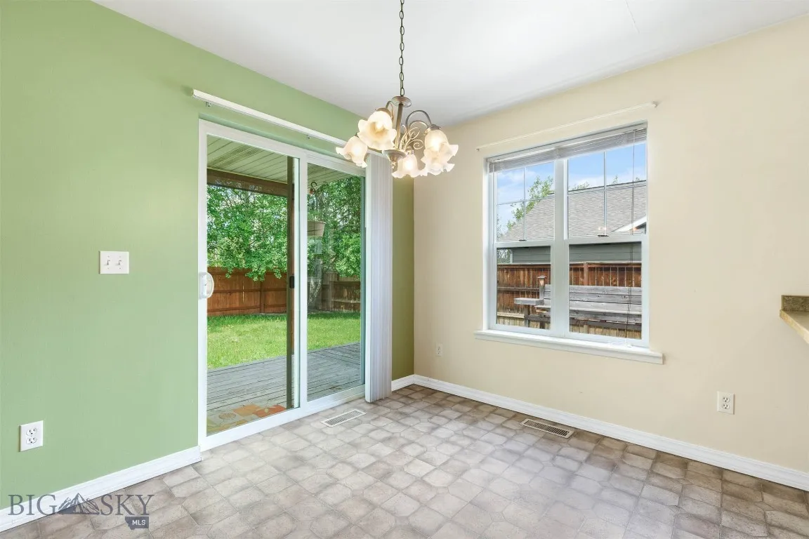 Dining looking to back deck that is partially covered